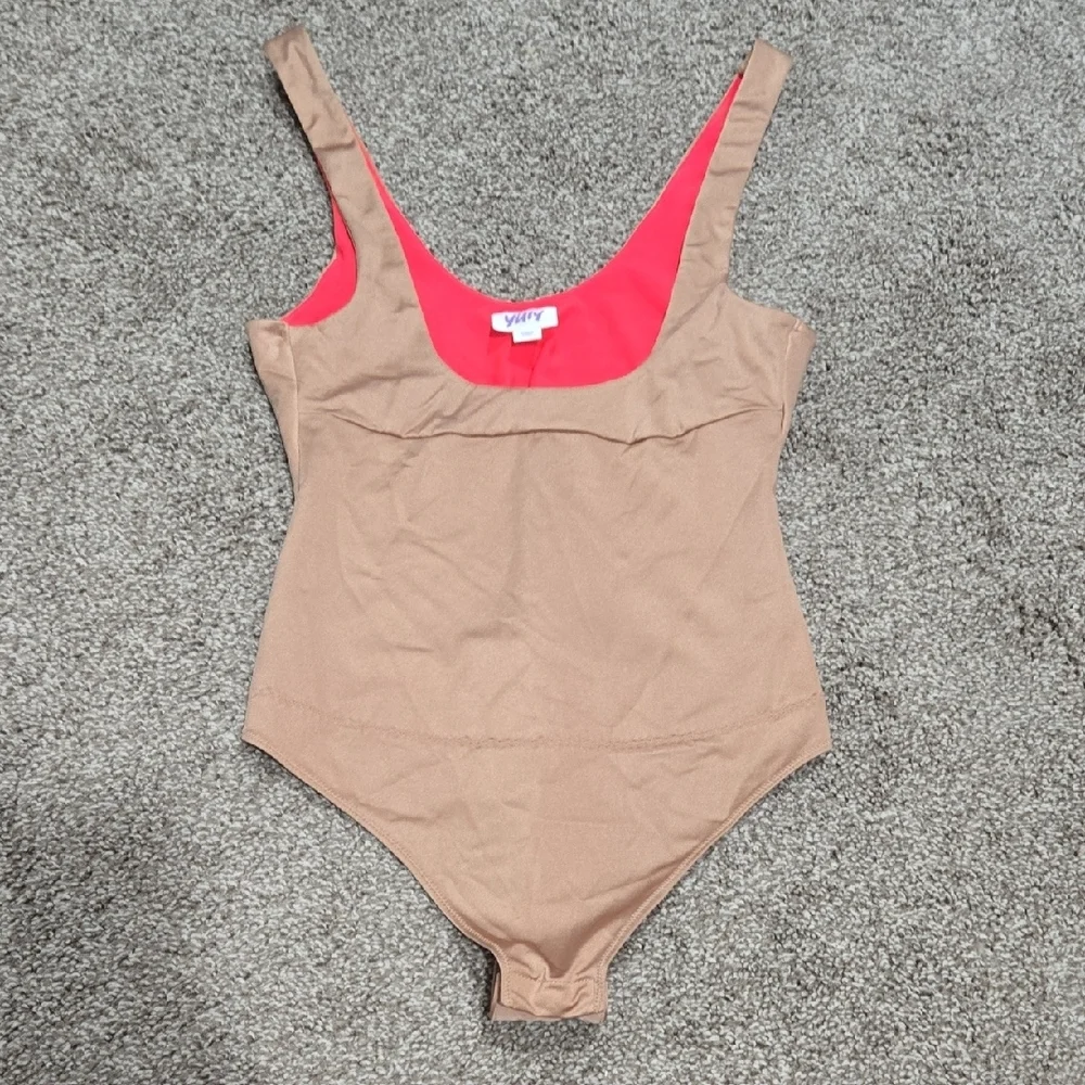 Yitty Headliner Shaping Open-Bust Thong Bodysuit in the Brown Sugar colorway.